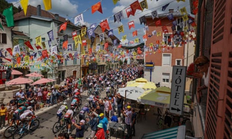The pack of riders cycle through Moirans-en-Montagne at the start of the 19th stage of the 110th edition of the Tour de France cycling race 173 km between Moirans-en-Montagne and Poligny.