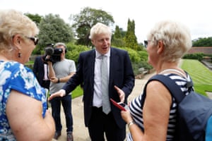 Boris Johnson talks to two women