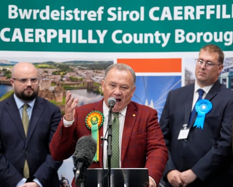 Plaid Cymru’s Lindsay Whittle (centre) speaks a after being declared winner of the Caerphilly byelection