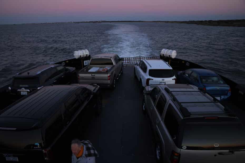 Passengers exit their cars on a ferry ride that connects two parts of Highway 12 between Hatteras and Ocracoke.