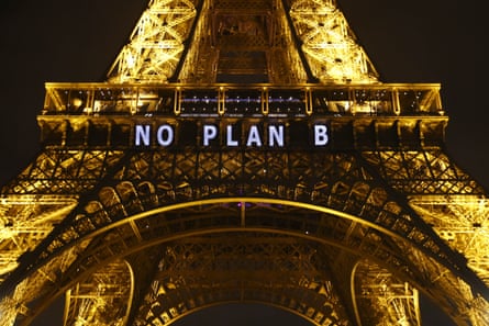 The slogan ‘no plan b’ is projected on to the Eiffel Tower in Paris, France