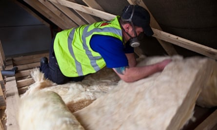 Sustainable loft insulation made from wool being installed in a roof in Kirklees.