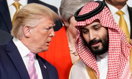 Donald Trump speaks with Mohammed bin Salman during a family photo session with other leaders and attendees at the G20 leaders summit in Japan in 2019.