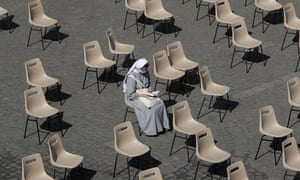 A nun waits for Pope Francis’ weekly general audience in San Damaso courtyard at the Vatican today