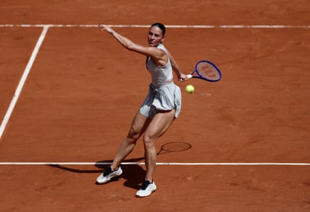 Marta Kostyuk plays a shot during her victory in the first round of the French Open