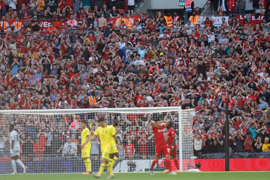 Liverpool fans react after Luis Diaz’s shot goes just wide.