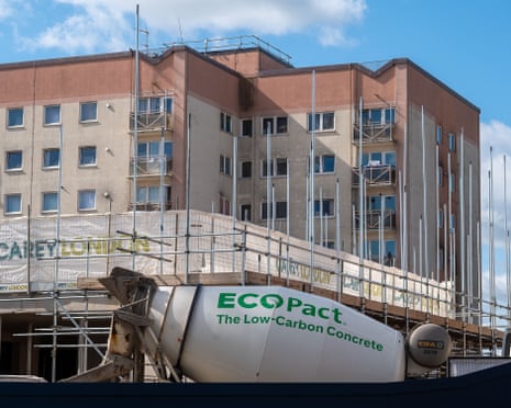 Flats under construction with a concrete truck in front
