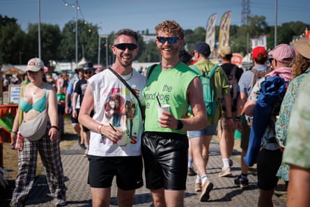 Two men, one in a Spice Girls t-shirt, one in a Brat t-shirt