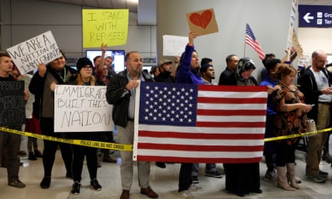 Protesters at at Dallas-Fort Worth International Airport denounce President Trump’s executive order on immigration.