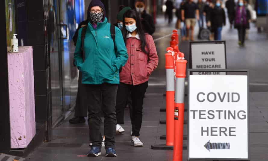 People wait in queues at a Covid-19 testing centre in Melbourne on May 26, 2021, as Australia’s second biggest city scrambles to contain a growing Covid outbreak.