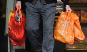 Man holding Sainsbury’s bags