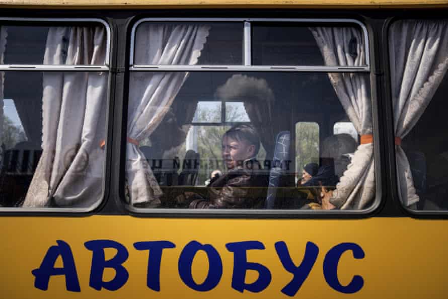 Women wait in a bus at a centre for displaced people in Zaporizhzhia, Ukraine.