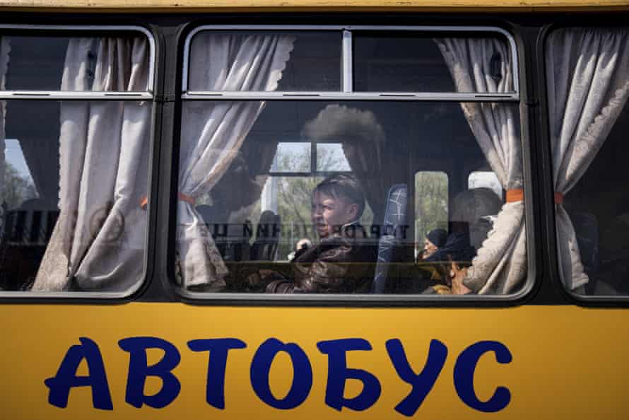 Russia-Ukraine war: Moscow plans to annex Donetsk and Luhansk, US says; Britain pledges another £300m in military aid – live | Ukraine 5 Women wait in a bus at a centre for displaced people in Zaporizhzhia, Ukraine.