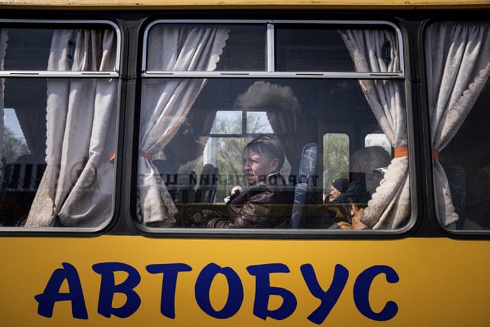 Women wait in a bus at a centre for displaced people in Zaporizhzhia, Ukraine on Monday, 2 May.