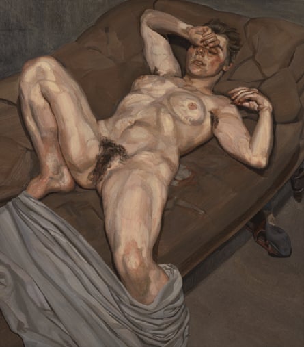 A young woman sprawled on a bed, naked, legs open