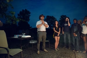 Abdul El-Sayed of Detroit talks to campaign volunteers during a cookout in Ann Arbor, Mich.