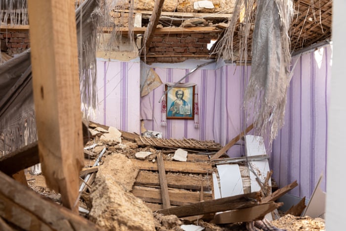 The Virgin Mary seen hanging on the wall of a destroyed church due to Russian shelling in the south of Ukraine.
