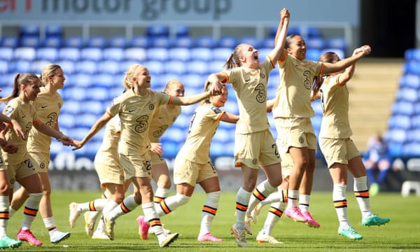 Chelsea players celebrate winning their fourth consecutive WSL title.