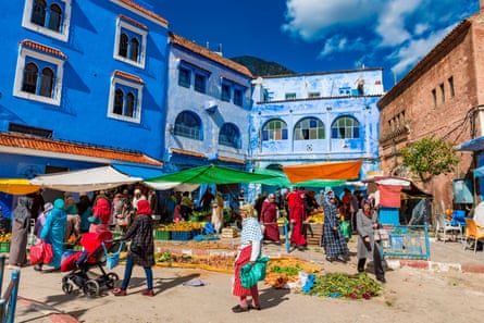People walk among food stalls in Tangier, Morocco.