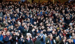 Burnley fans celebrate after just three minutes when Ashley Barnes opened the scoring in their match against Manchester United at Old Trafford
