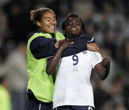 Eniola Aluko and Rachel Yankey of England celebrate qualifying for the World Cup after the match between France and England on 30 September 2006.