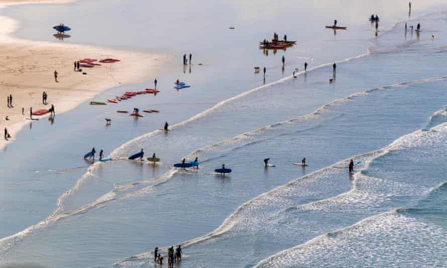 Surfers take to the surf at Saunton Sands