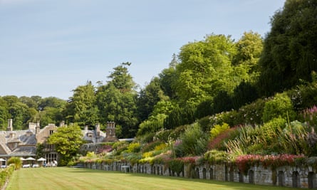 A long lawn at Hotel Endsleigh, one side framed by a terraced garden border