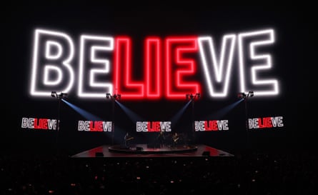 The immersive screen displays a large BELIEVE sign in red and white letters