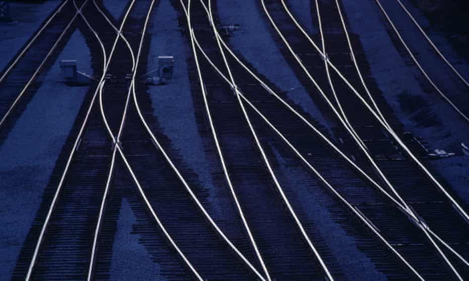 Railroad tracks, in train yard, dusk