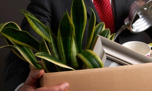 Redundant businessman with possessions in box