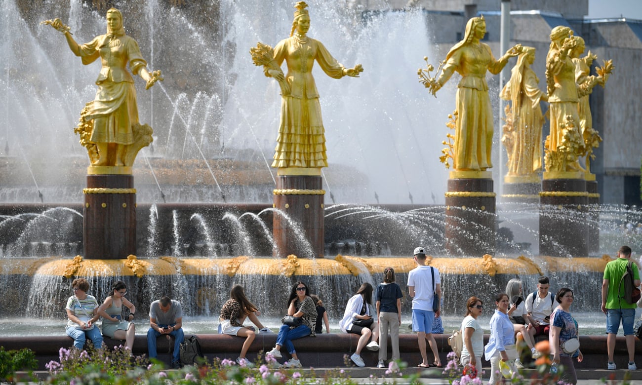 People spend time by a fountain in Moscow, Russia.