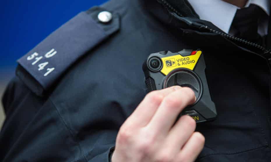 A police officer demonstrates a body camera