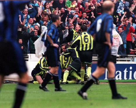 Manchester City's Paul Dickov is buried under ecstatic team-mates celebrating his late, late equaliser against Gillingham, which sent their 1999 Second Division play-off final at Wembley stadium into extra-time. Manchester City eventually won the match in a penlty shoot-out and escaped the third tier.
