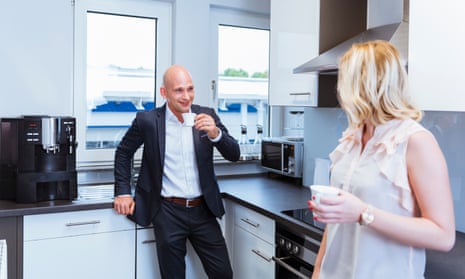 Man and woman in office kitchen