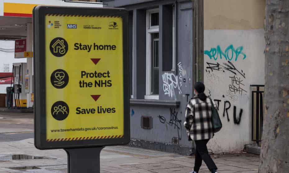 An information poster with a ‘Stay at home’ message in east London.