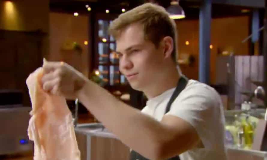 male contestant holds large chunk of white meat