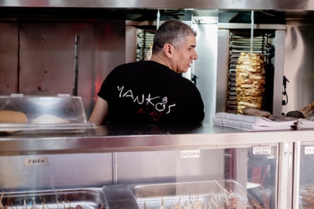 A chef preparing kebabs
