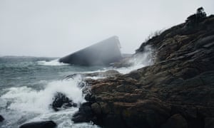 Under is reminiscent of a whale resting its head on the rocky shore.