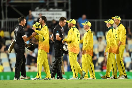 Trent Boult and Mitchell Santner congratulate Australia following their win.