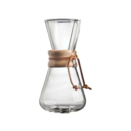A clear glass hourglass-shaped coffee carafe with a wood collar tied by leather