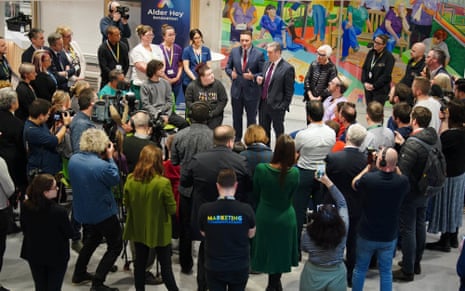 Keir Starmer and Wes Streeting speaking as a crowd of people looking on