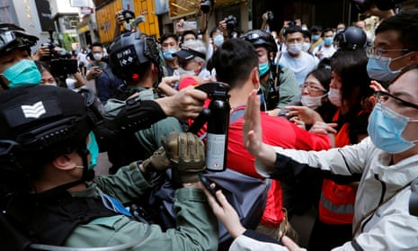 Anti-government demonstrators scuffle with riot police during a lunch time protest as a second reading of a controversial national anthem law takes place in Hong Kong, China May 27, 2020. REUTERS/Tyrone Siu