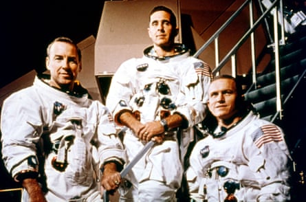 three astronauts pose for a photo