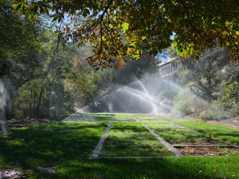 Sprinklers spraying water on the lush lawns of Brigham Young University.
