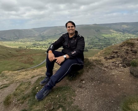 Prateek Joshi sits on top of a hill
