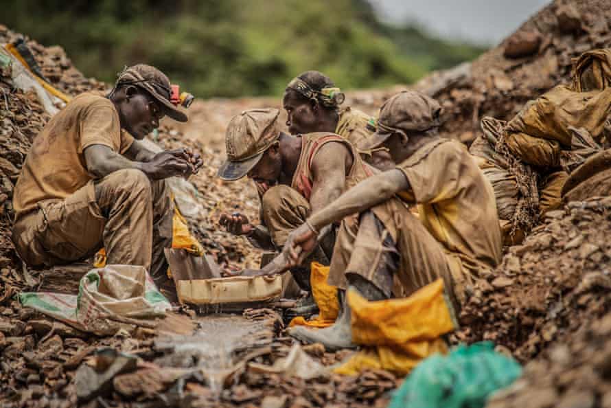 Artisanal miners pan for gold at a mine in Kamituga.