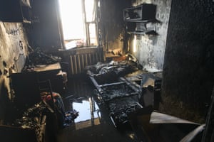 Damage to an apartment complex is seen after the apartment complex was struck by artillery shells in Kyiv, Ukraine
