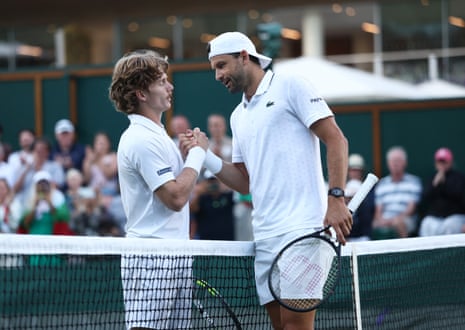 Grigor Dimitrov shakes hands with Dan Sweeney.