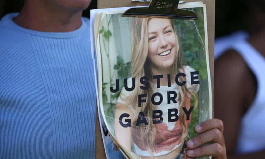 A idiosyncratic with a ‘justice for Gabby’ placard astatine the entranceway of Myakkahatchee Creek biology parkland successful Florida