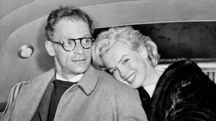 Marilyn Monroe and husband Arthur Miller in car at Idlewild Airport after arriving from Kingston, Jamaica